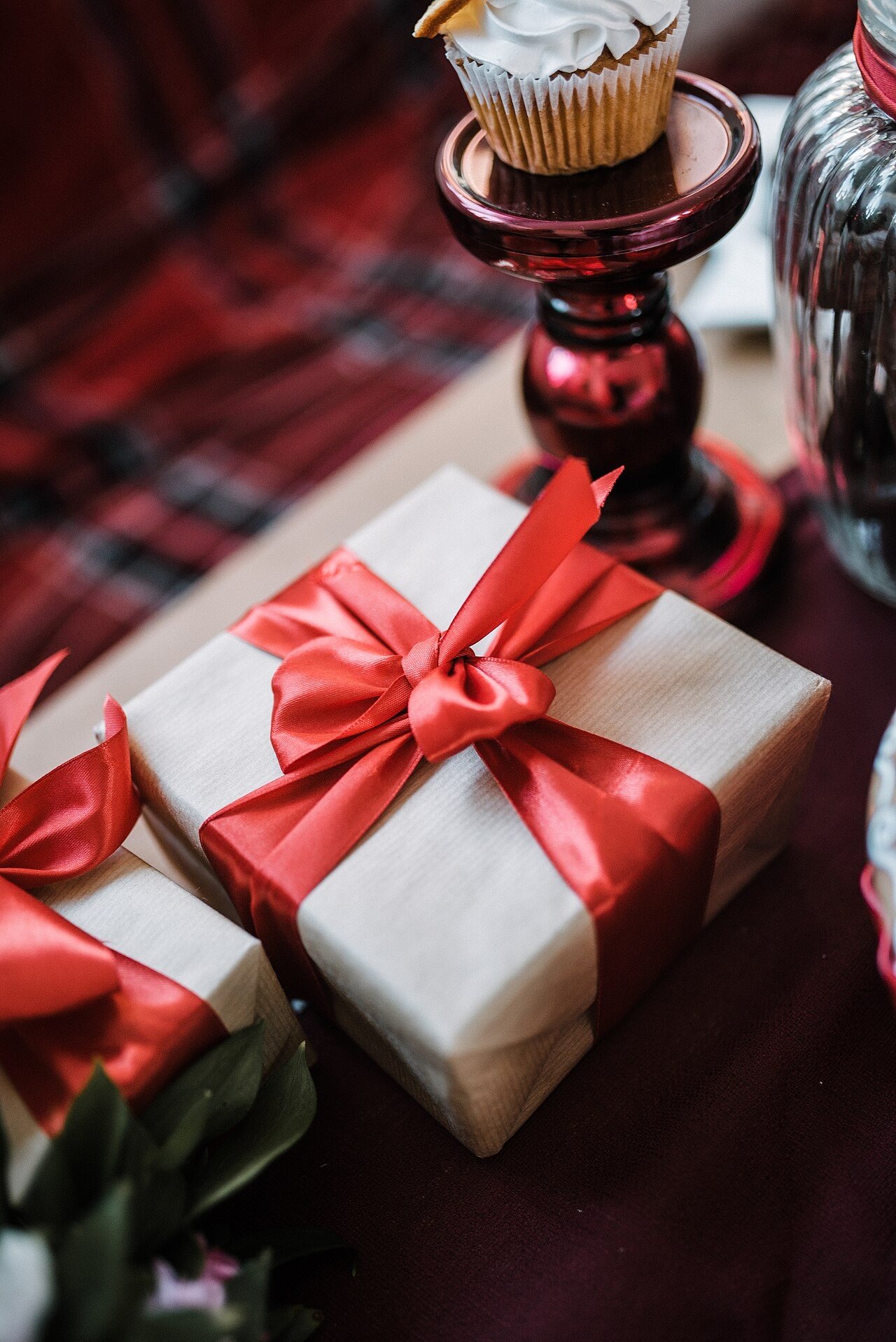 Brown gift box tied with a red ribbon