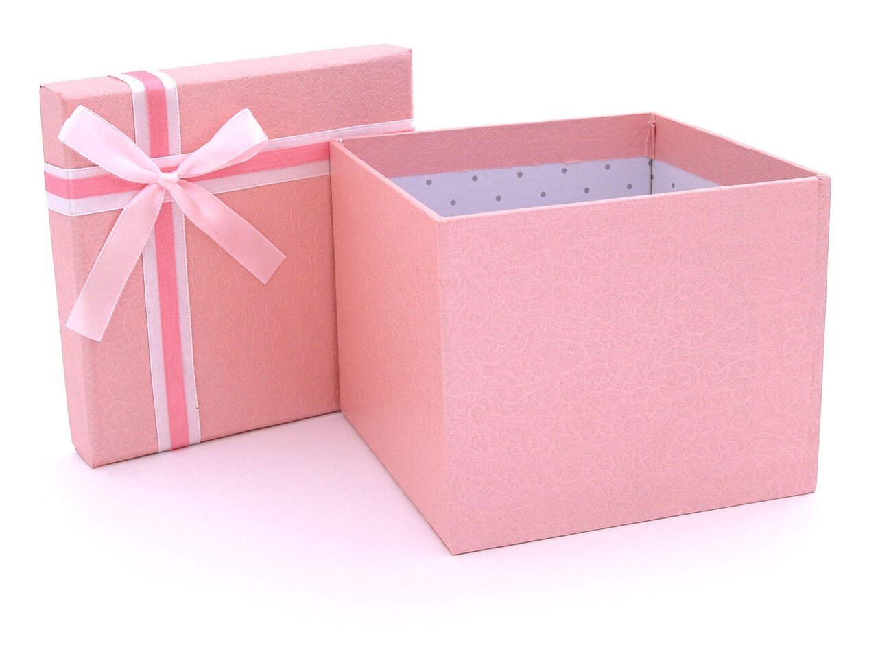 Pink gift box with a white ribbon