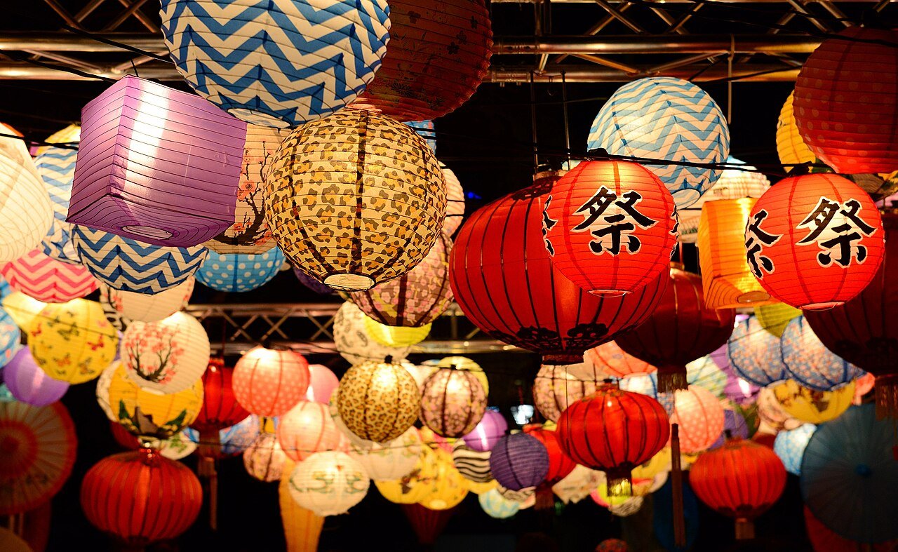 Lanterns illuminating an outdoor evening celebration