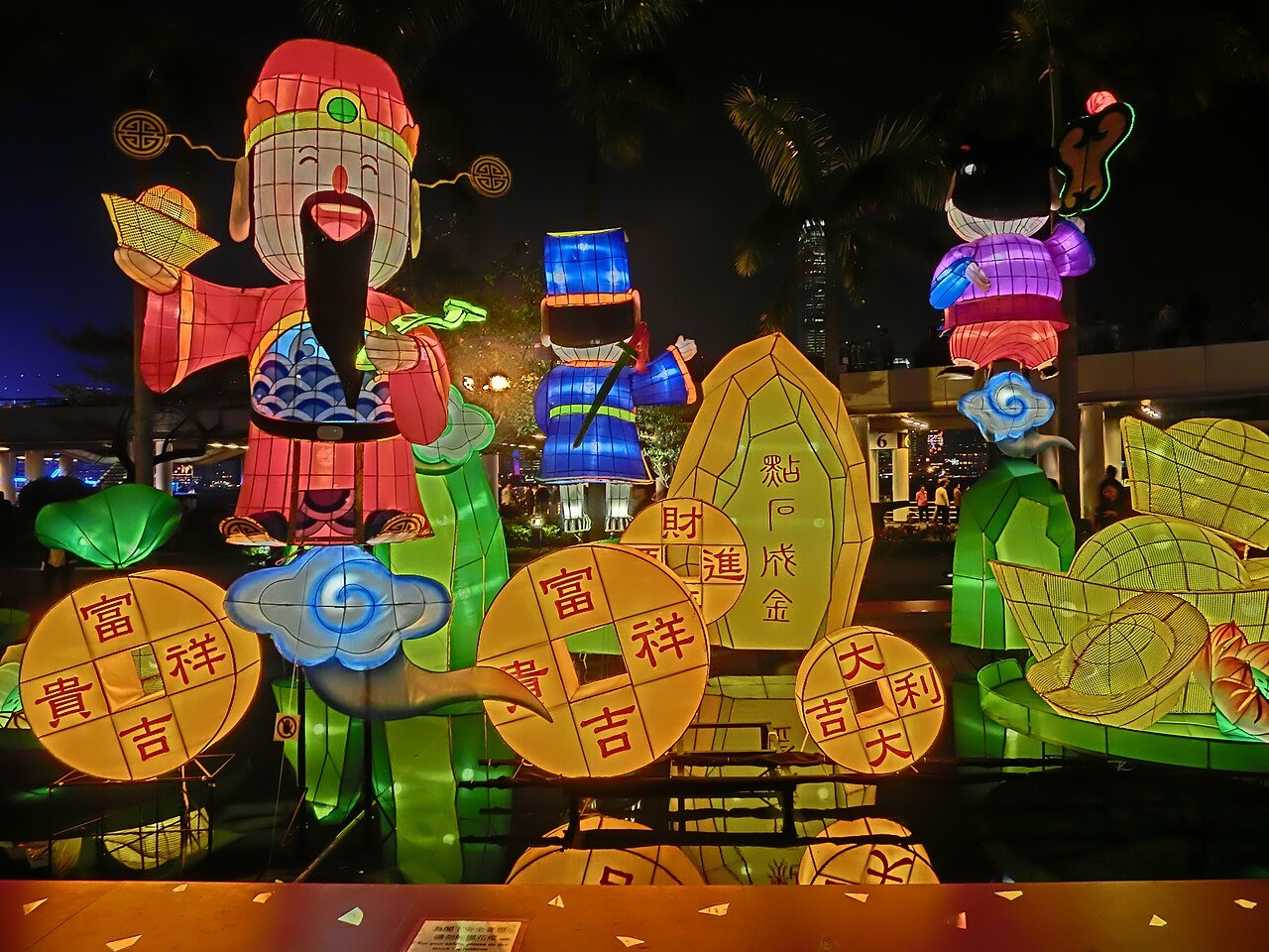 Golden fountain lights glowing in a garden at night