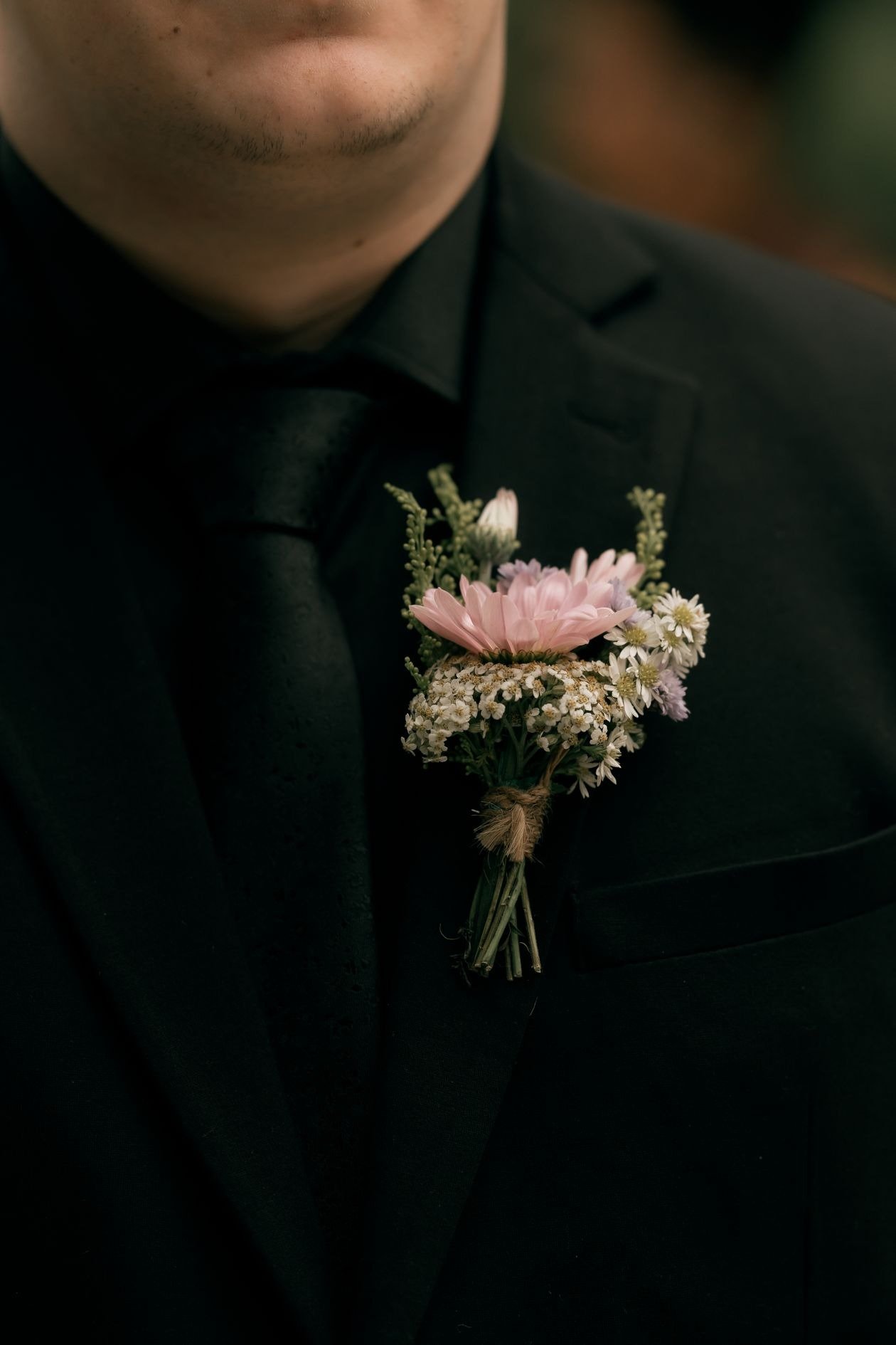Close up of brooch on suit lapel