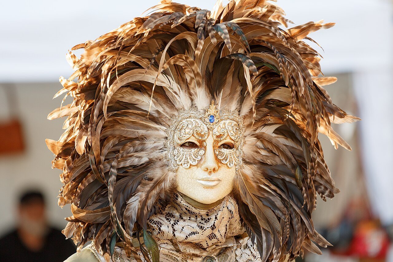 Venetian carnival mask and costume in gold and black