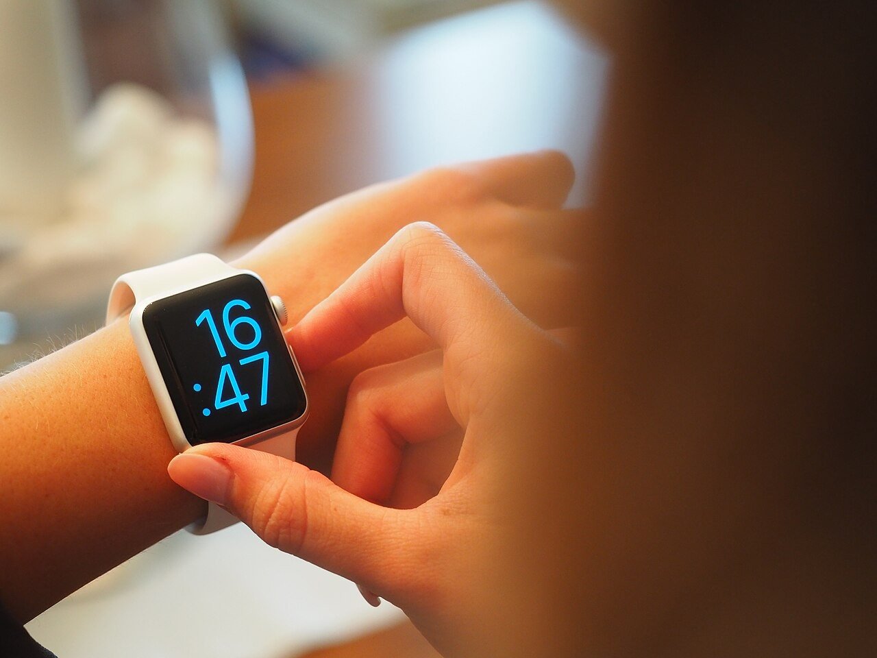 Smartwatch on a wrist showing the time