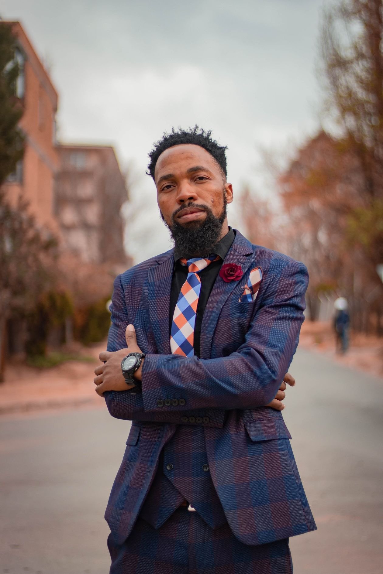 Bold statement brooch on patterned suit