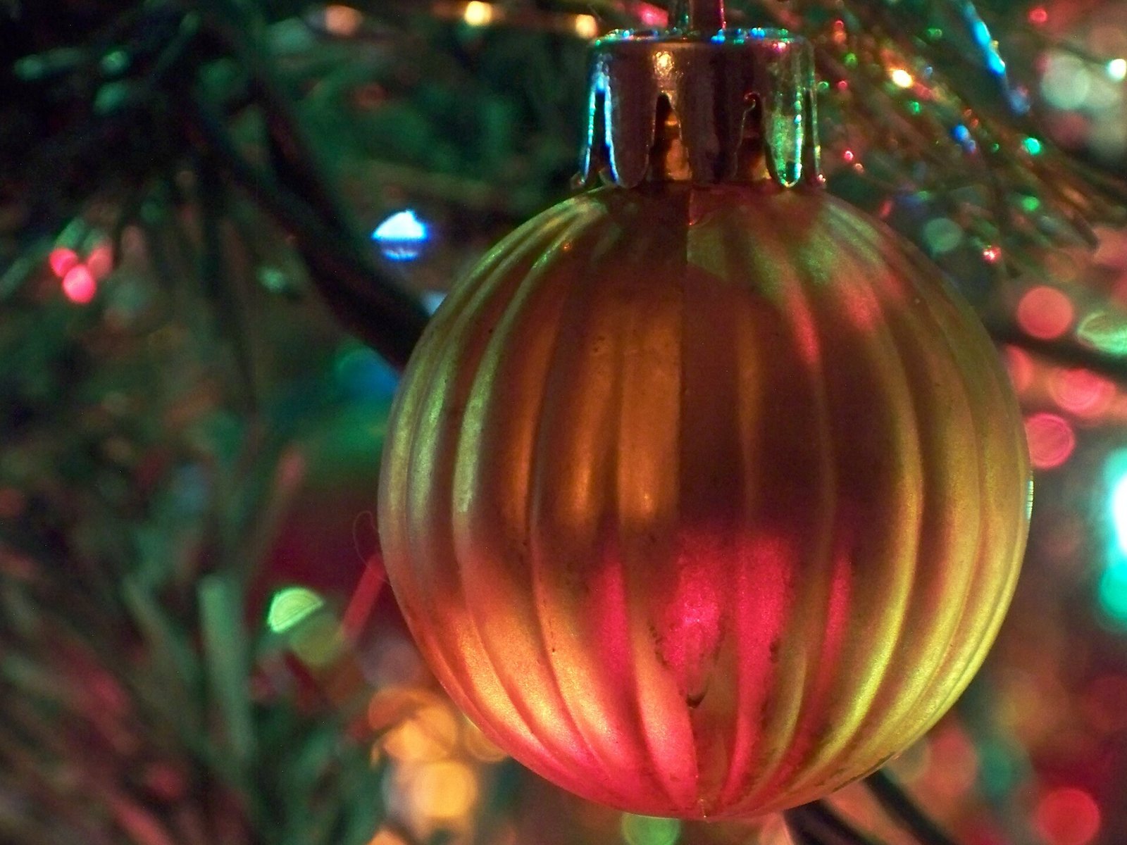 DIY gold-painted pinecones and emerald ornaments being crafted