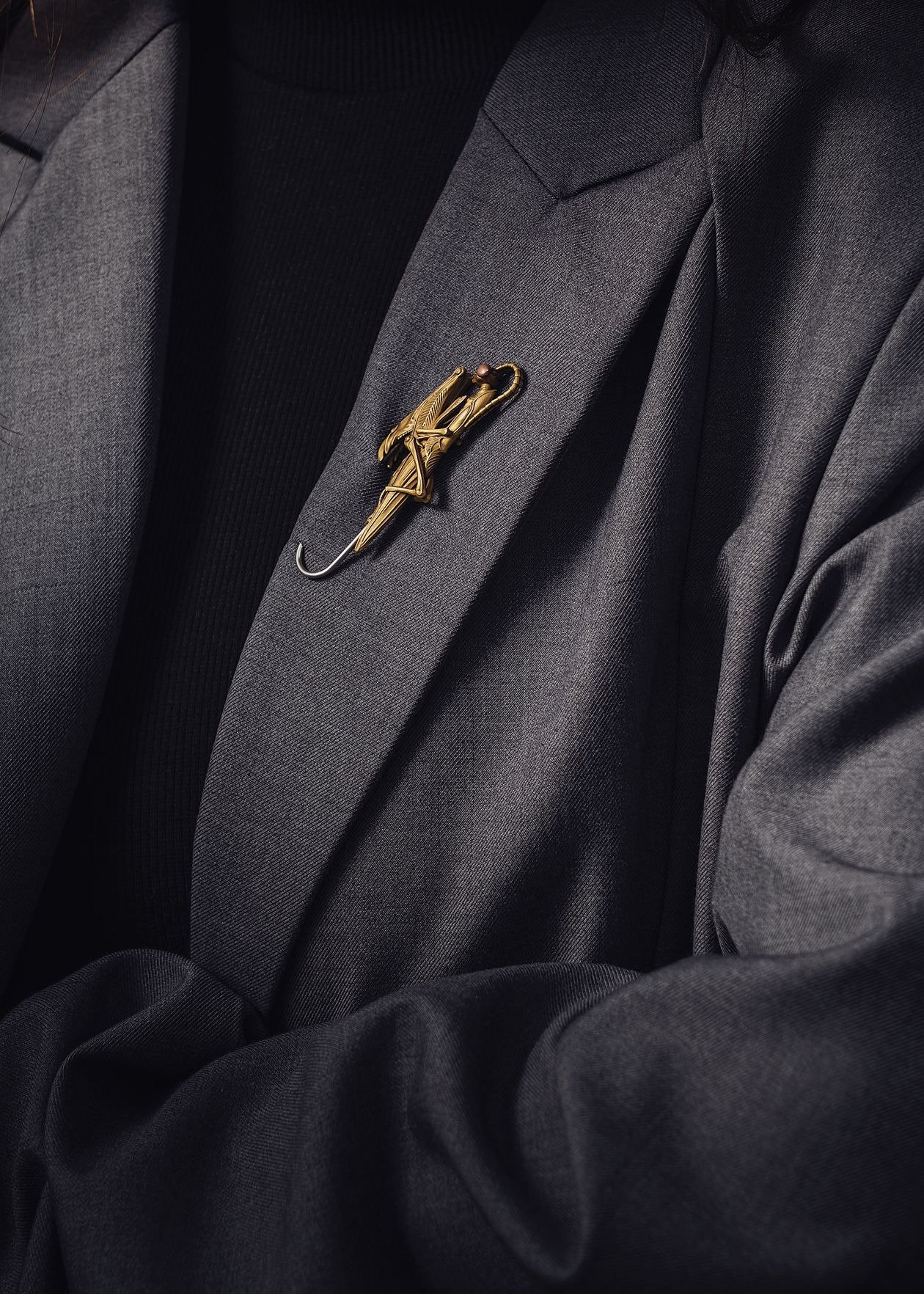Ceremonial brooch worn with formal suit