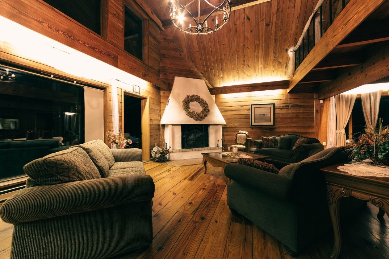 Cozy farmhouse living room with stone fireplace