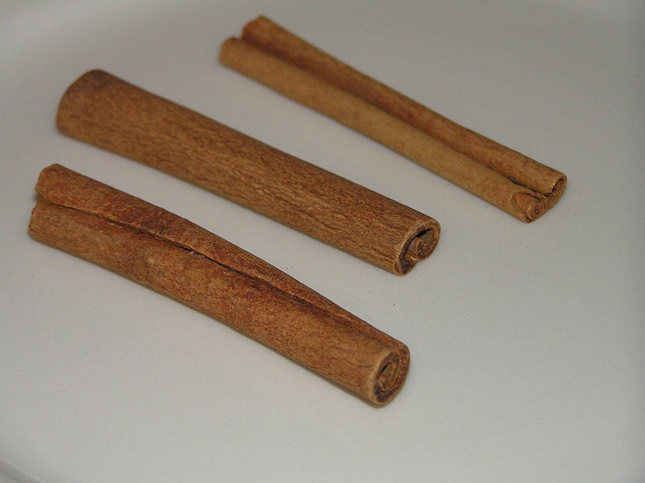 Cinnamon sticks arranged on a surface