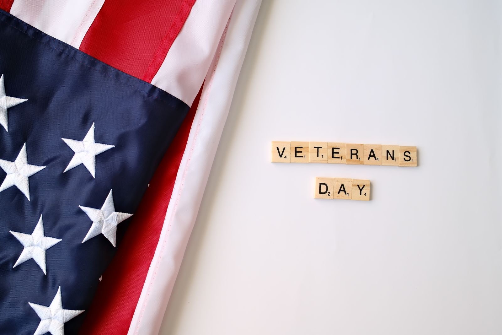 Red poppy remembrance arrangement inspiring a Veterans Day gratitude centrepiece