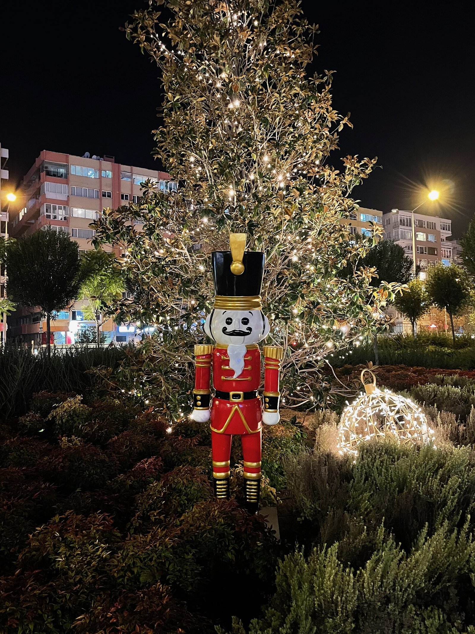 Life-size nutcracker soldiers flanking a front door at Christmas