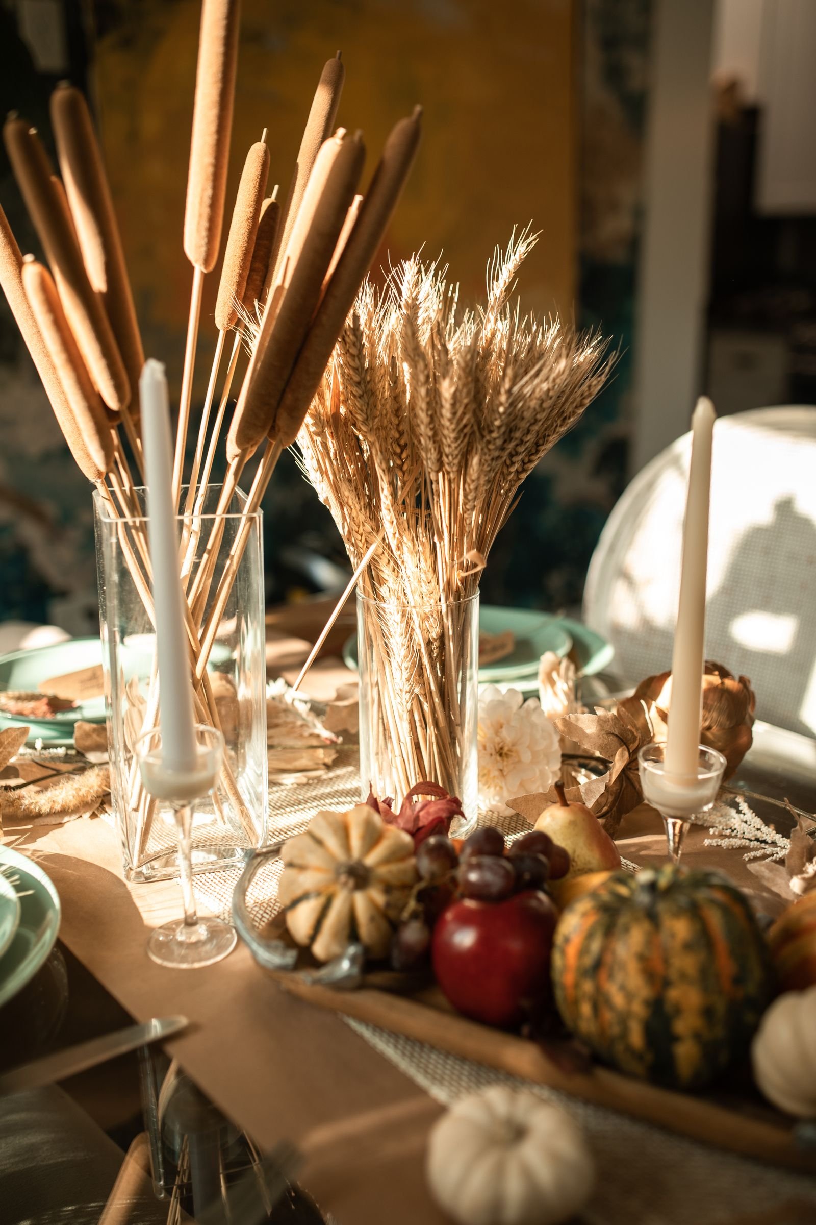 Fall table centrepiece with candles, gourds and wheat made affordably