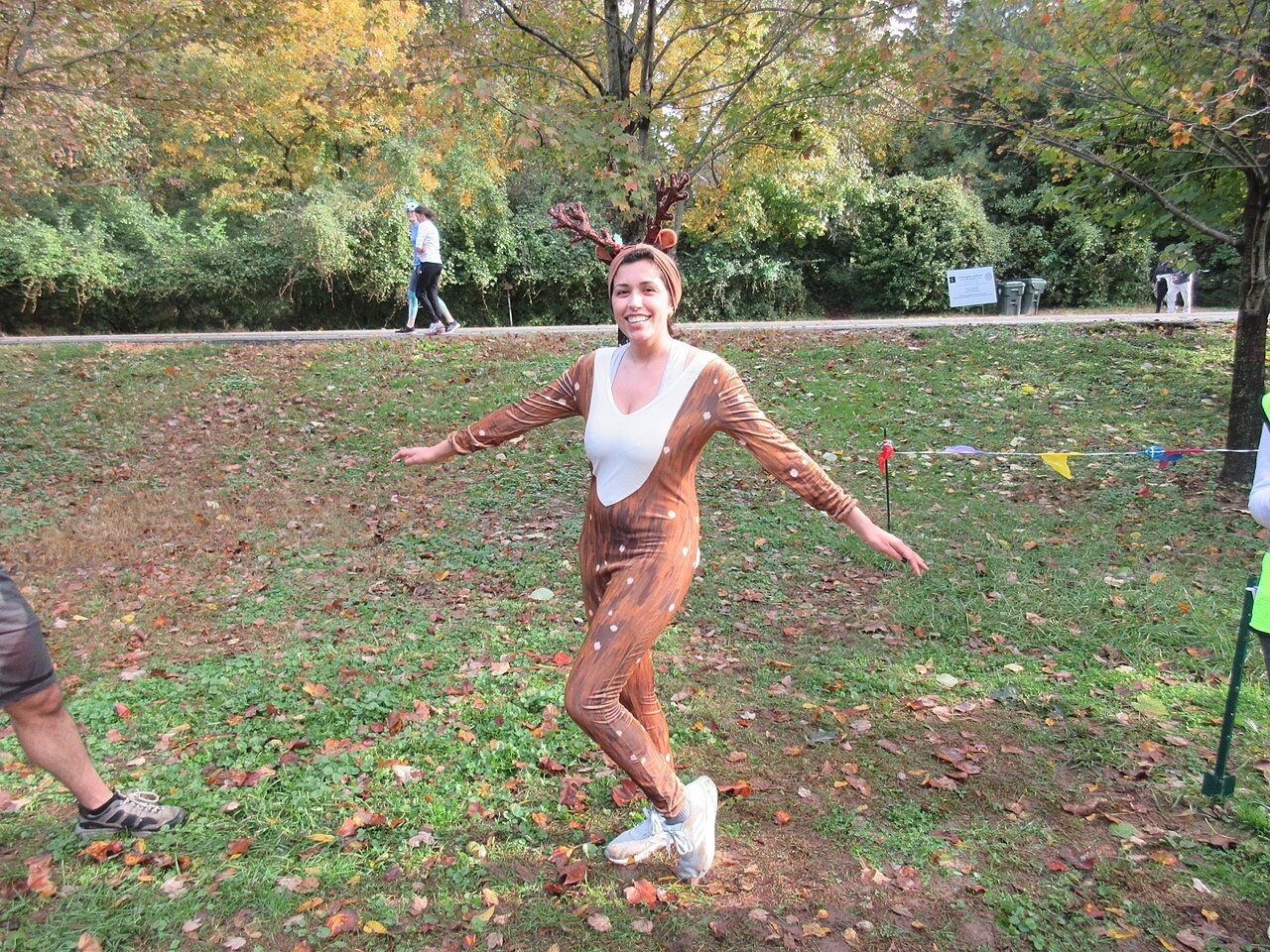 Person wearing a reindeer costume at a parkrun
