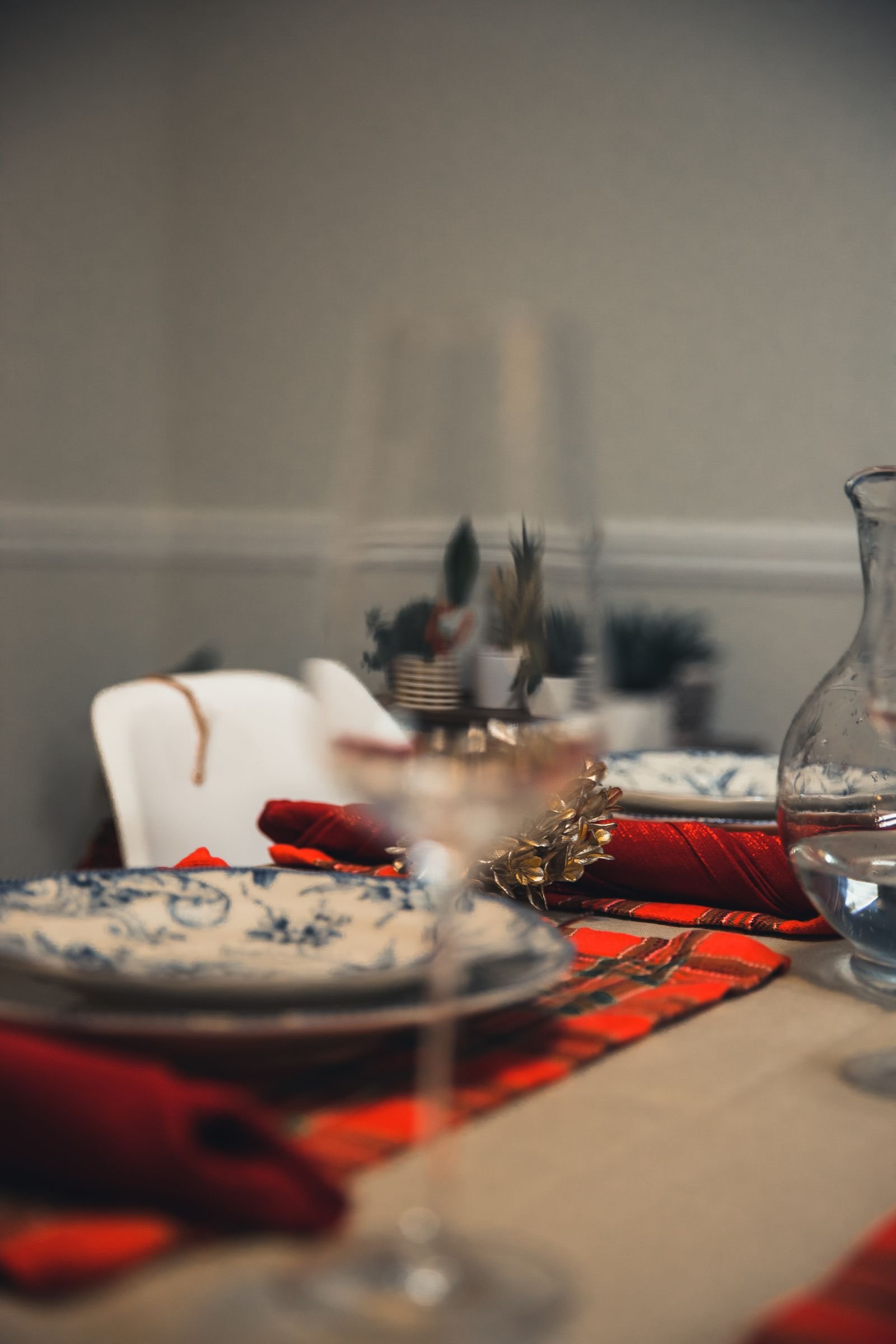 Wineglass on a festive table with checkered cloth during celebrations