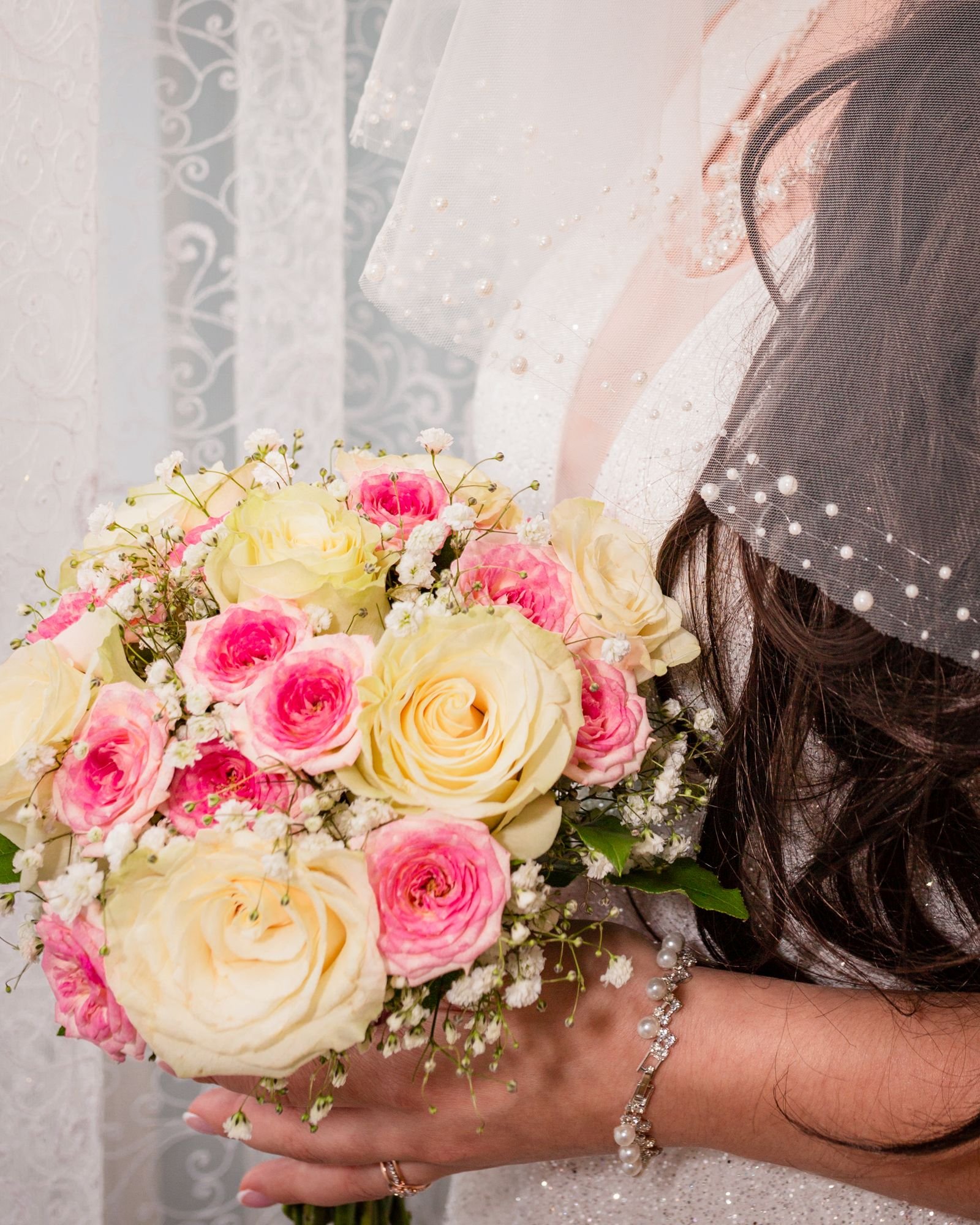 Opalite wedding flowers glowing softly on an iridescent tablescape