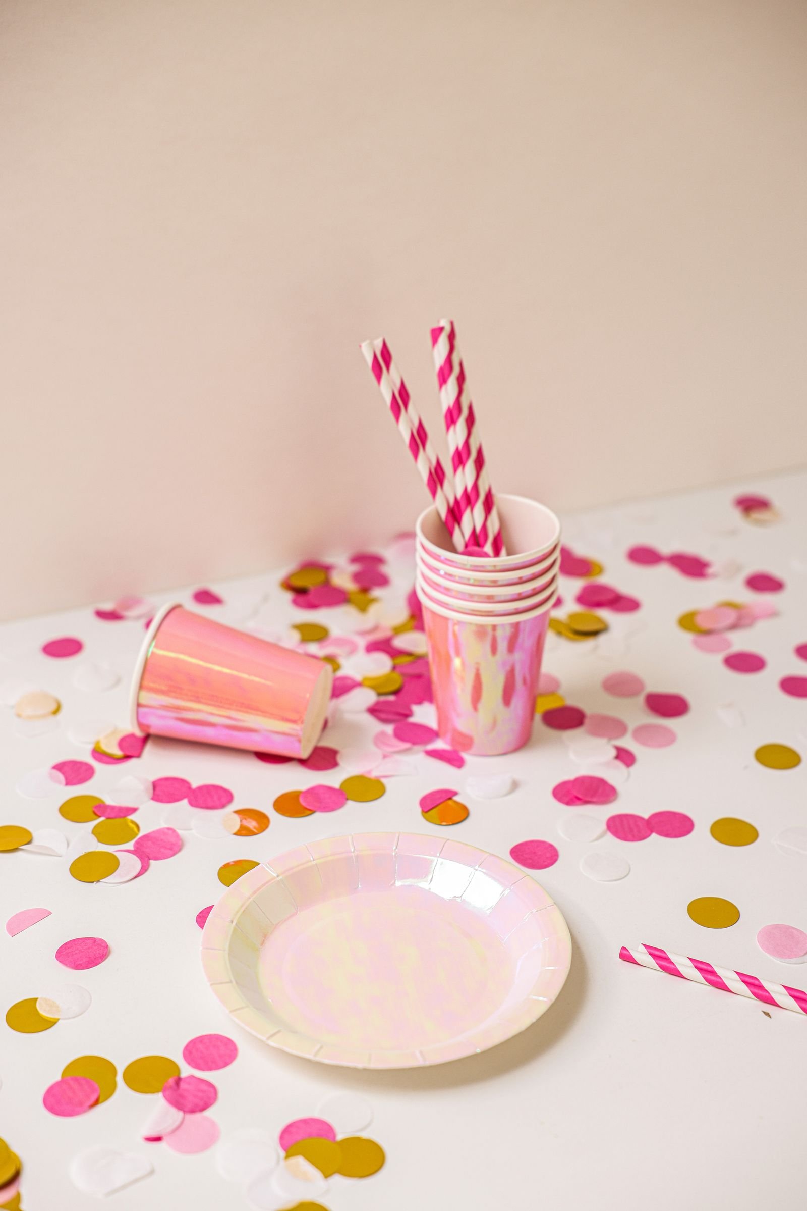 Bright festive party setup with colourful iridescent tableware