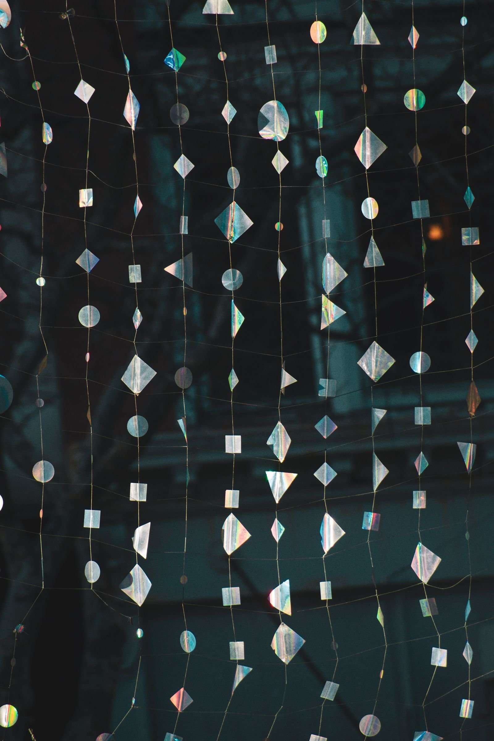 Intricate hanging decorations with shimmering silver geometric shapes