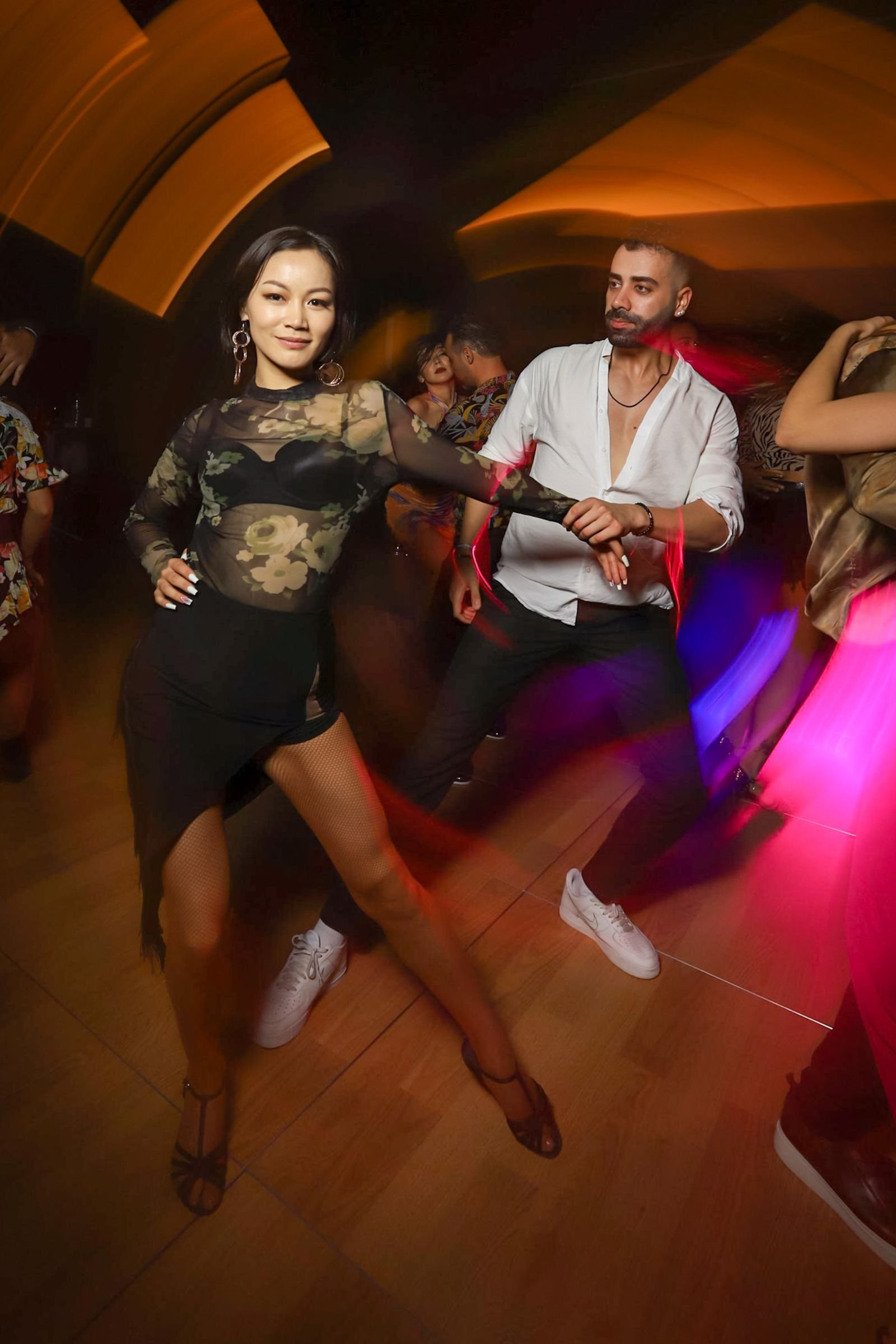 Lively dance club atmosphere with a live band at a wedding