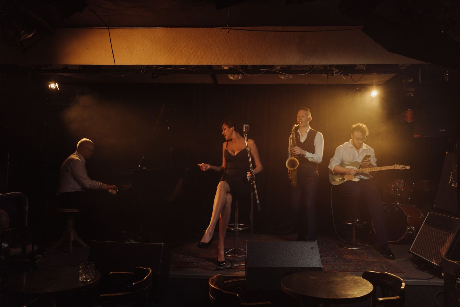 Jazz band performing with a female singer on stage at a wedding