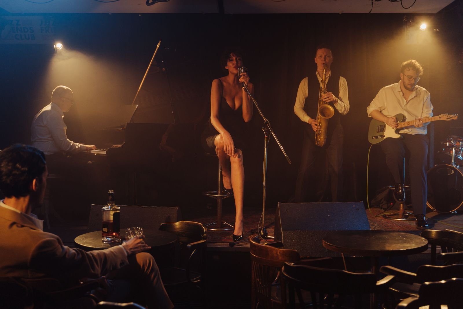Jazz band performing live on stage in a dimly lit club