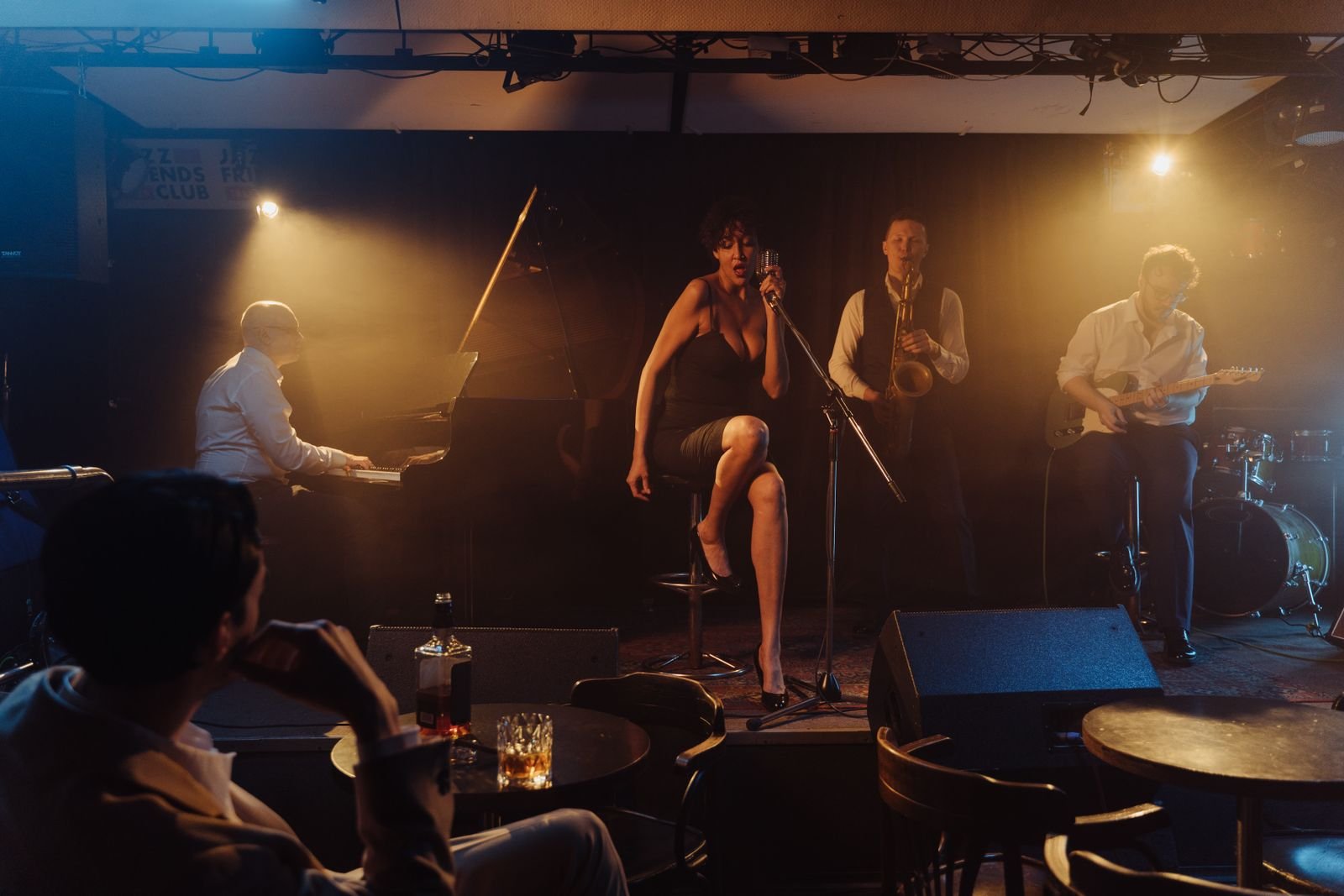 Jazz musicians performing live in a dimly lit nightclub wedding